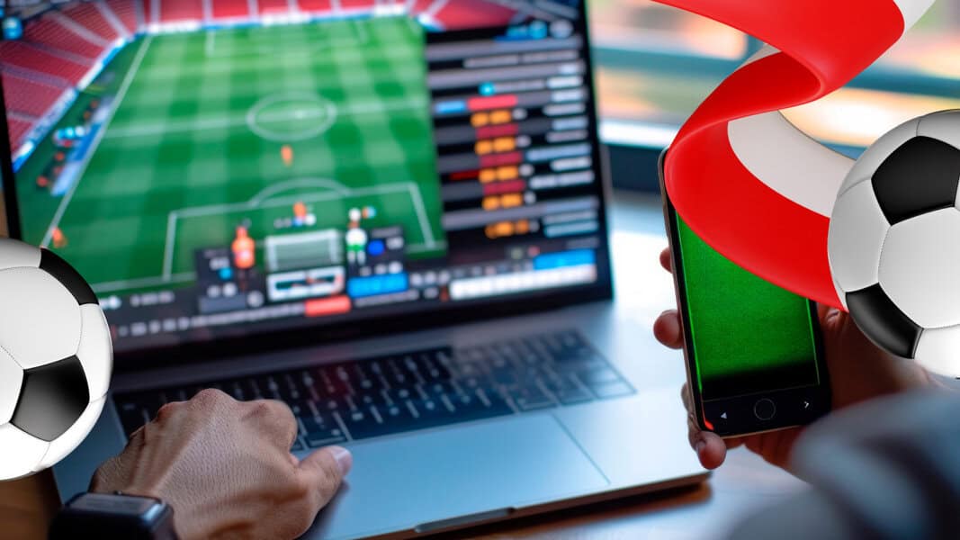 Person using laptop and smartphone to view PKO BP Ekstraklasa betting interface showing scoring charts, soccer balls, and a red ribbon overlay