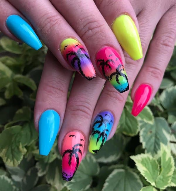 Tropical sunset nail art with palm trees