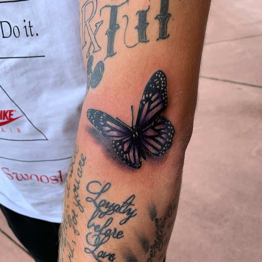 A forearm realistic purple butterfly tattoo