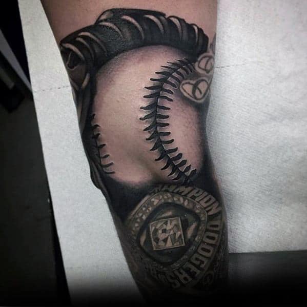 Realistic black and grey tattoo of a baseball glove gripping a ball, paired with a detailed championship ring featuring the Dodgers logo.