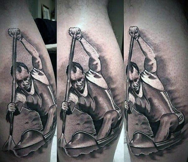 Alt text: Detailed tattoo of a man rowing a canoe, showcasing strength and determination in black and grey shading.