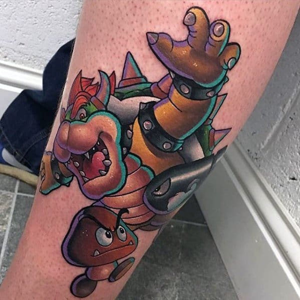 Colorful Bowser tattoo on a man's leg featuring dynamic shading, bold outlines, and classic Super Mario characters in action.