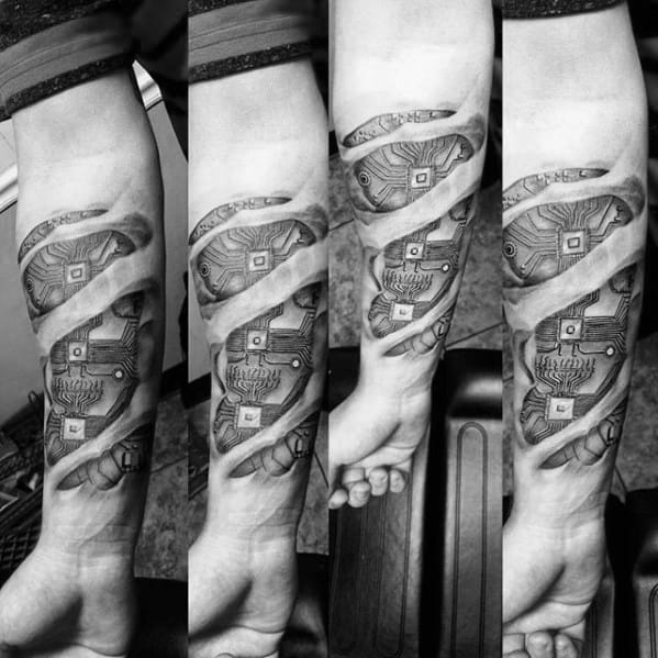 Detailed biomechanical-style tattoo on a man's forearm showing computer circuits and gears beneath torn skin effect.