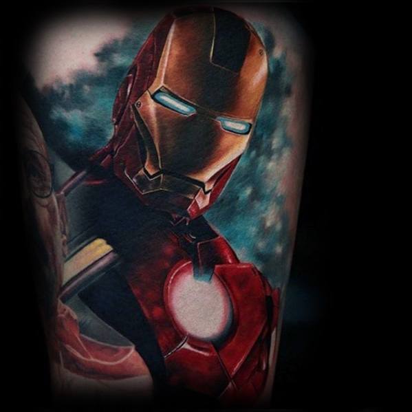 Iron Man tattoo showcasing a highly detailed close-up of the superhero's helmet and armor, with glowing blue eyes and a vibrant, shaded background.