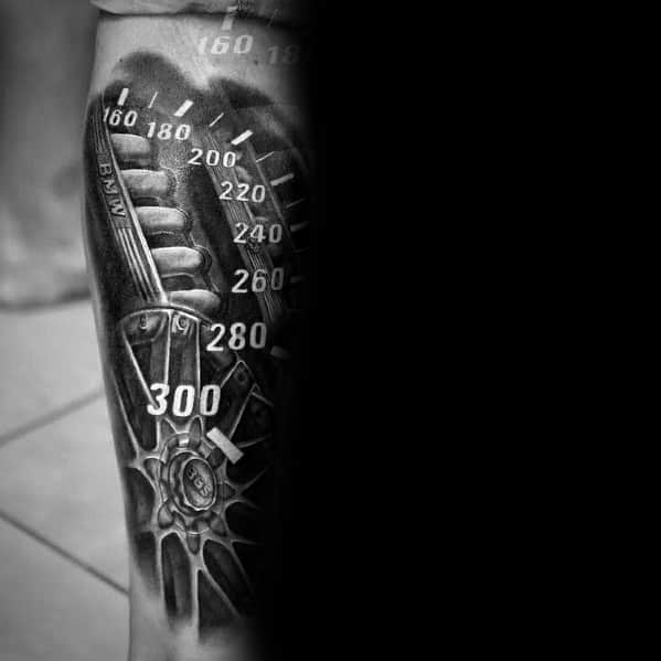 Realistic BMW speedometer tattoo on leg, featuring bold 3D shading and mechanical elements for a high-performance, adrenaline-fueled design.