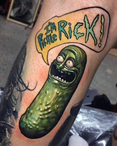 Colorful Pickle Rick tattoo with bold shading and a speech bubble saying 'I'm Pickle Rick!' on the leg, capturing a vibrant look.