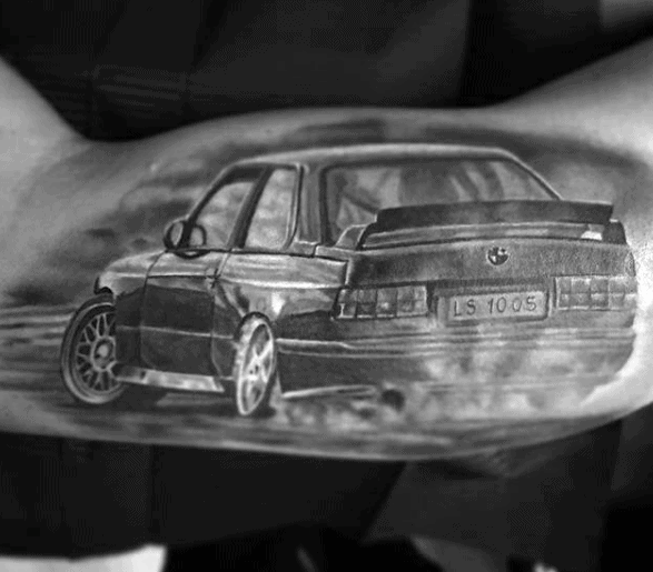 Realistic BMW E30 M3 tattoo on forearm, featuring a drifting scene with detailed shading for a bold and dynamic automotive look.