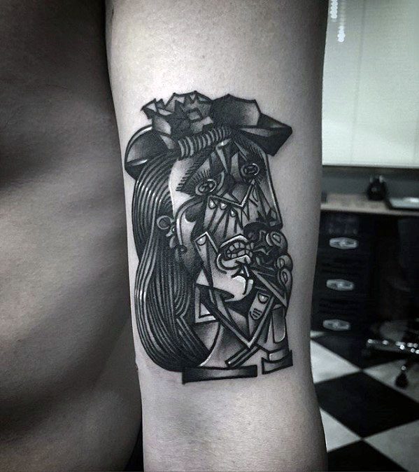 Tattoo of Picasso’s *Weeping Woman* in bold black ink, capturing emotional intensity with sharp lines and cubist detailing.