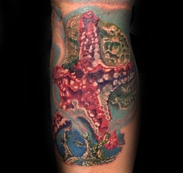 Colorful 3D starfish tattoo with ocean-themed details and coral accents, creating a vivid underwater effect on the arm.
