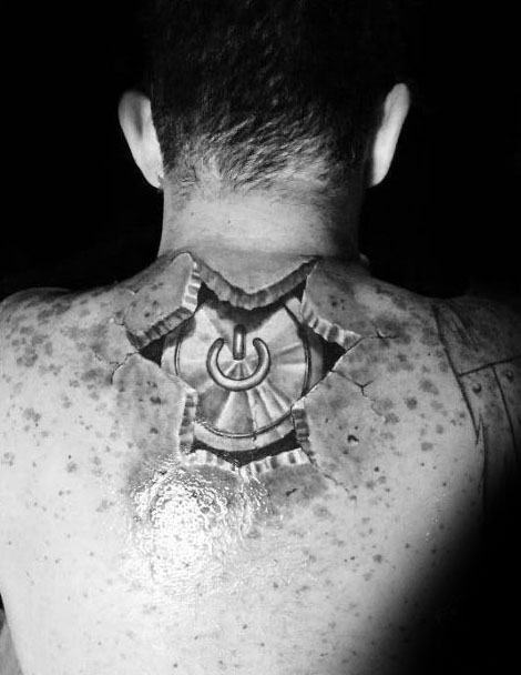 Realistic torn skin tattoo on upper back revealing a mechanical power button beneath, designed with detailed shading and depth.