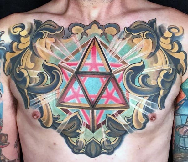 Vibrant chest tattoo with a glowing geometric pyramid and ornate golden frame, symbolizing energy, balance, and spiritual awakening.