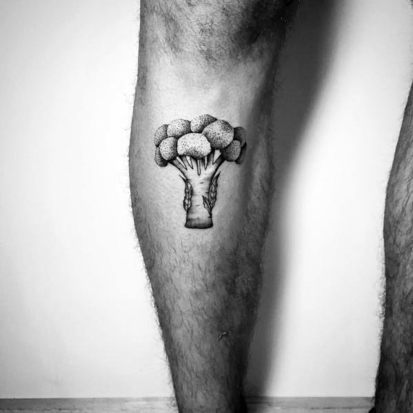 Black and gray broccoli tattoo on the calf, featuring fine shading and a detailed design for a bold yet minimalist look.