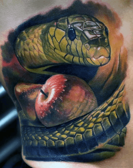 Tattoo of a realistic snake coiled around a red apple on skin