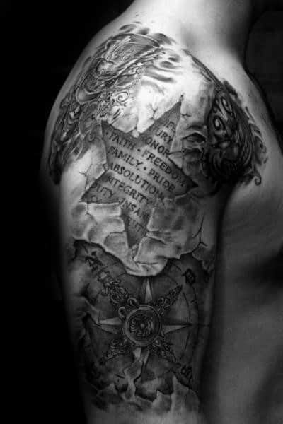 3D star and compass tattoo sleeve with cracked skin effect and engraved words like honor, pride, and integrity across the upper arm.