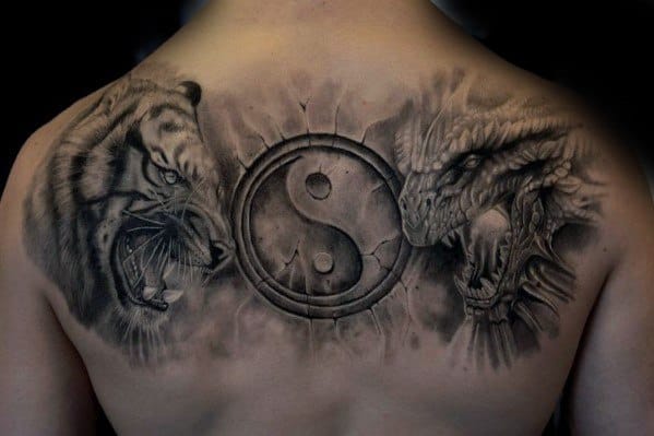 Back tattoo featuring a dragon on the right, a tiger on the left, and a yin-yang symbol in the center