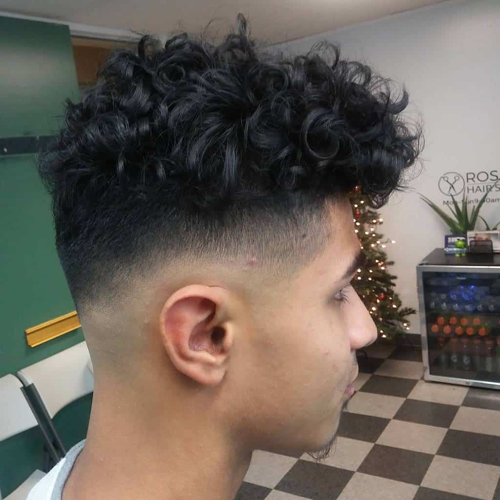 A Jewfro Hairstyle With A High Fade And A Side Burn