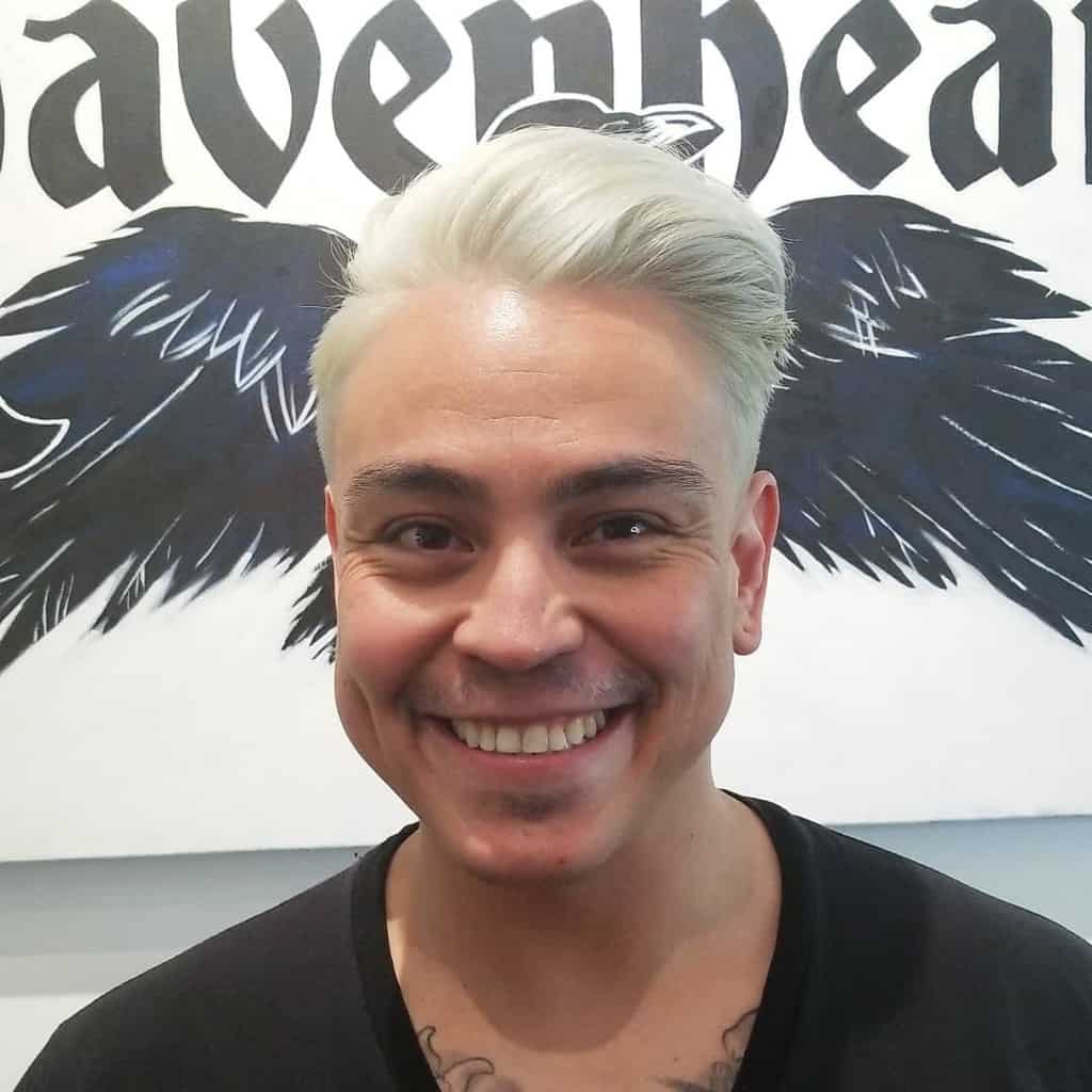 A Blond Men’s Haircut With Hair Combed Over On The Side In Opposite Directions