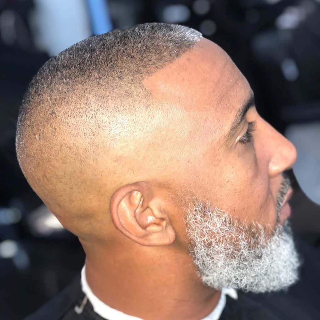 A Bossy Hi Top Fade Featuring Long Flat Hair On Top With Gray Highlights