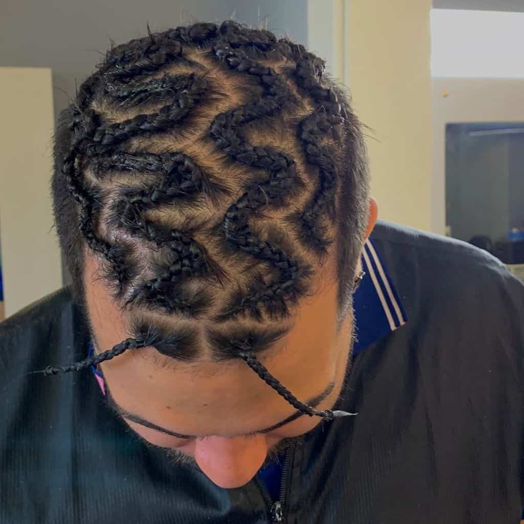 A Cornrow Hairstyle For Men With Zig Zag Patterns On Top Of The Head