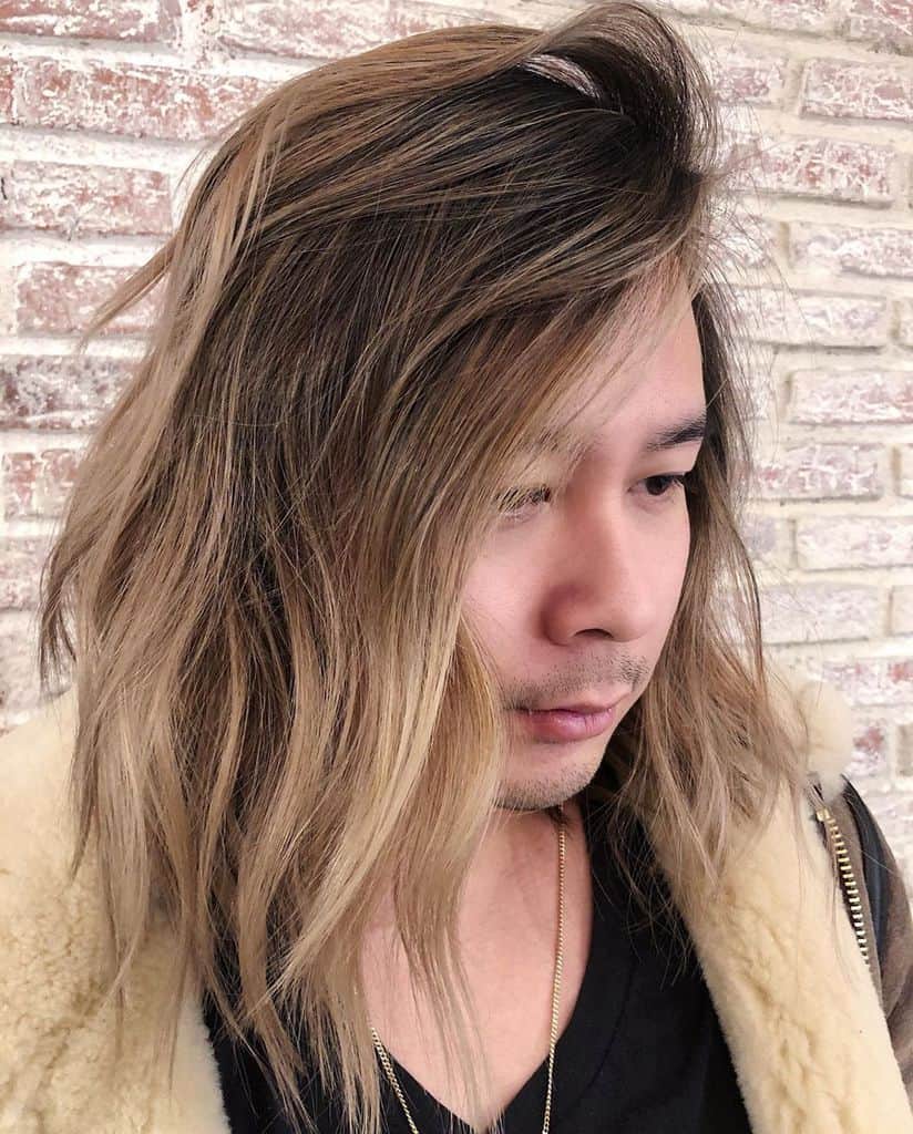 A Man Rocking Naturally Flowing Long Blond Hair.