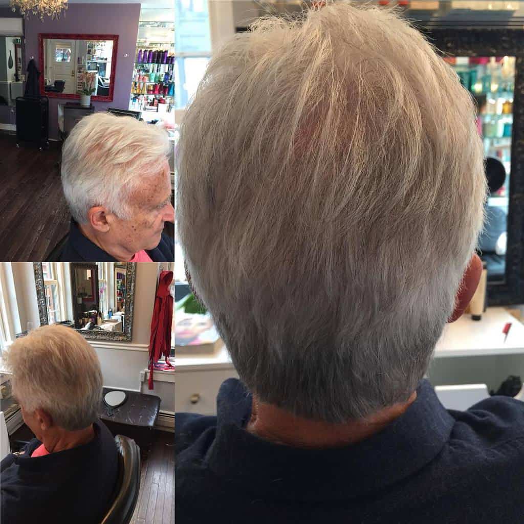 A Man Wearing Light Gray Hair Paired With Elegant Layers To Boost Hair Volume