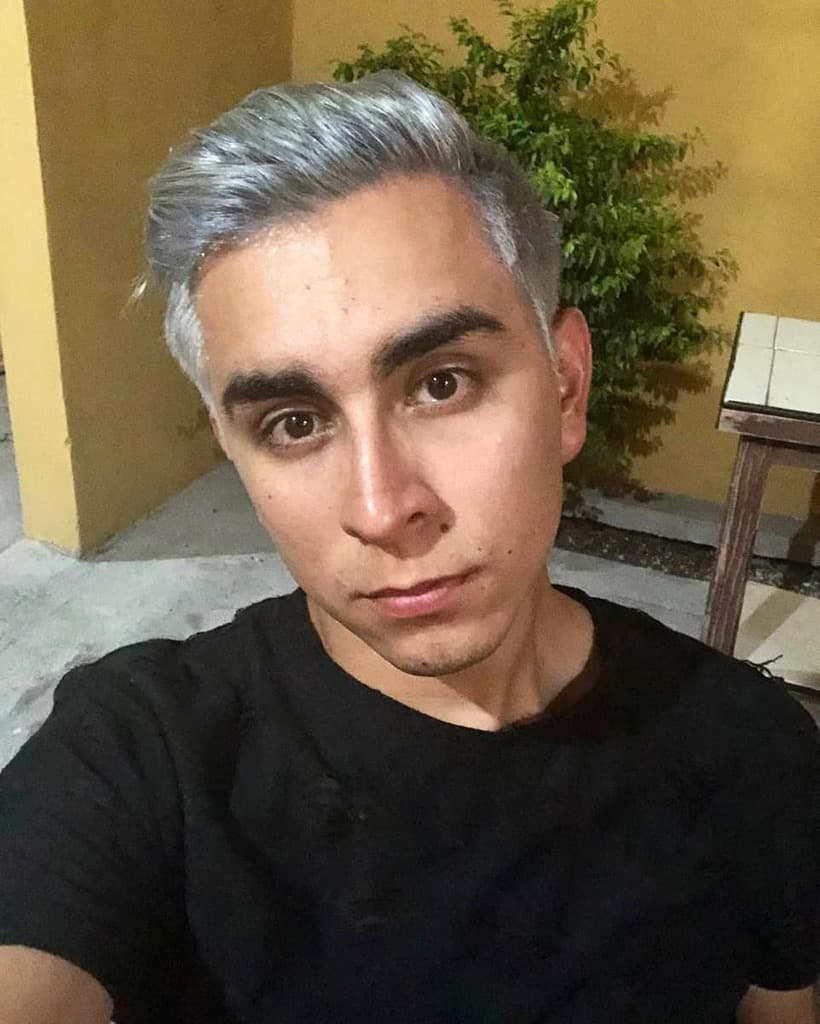 A Modern Textured Pompadour Haircut For Men With Gray Hair