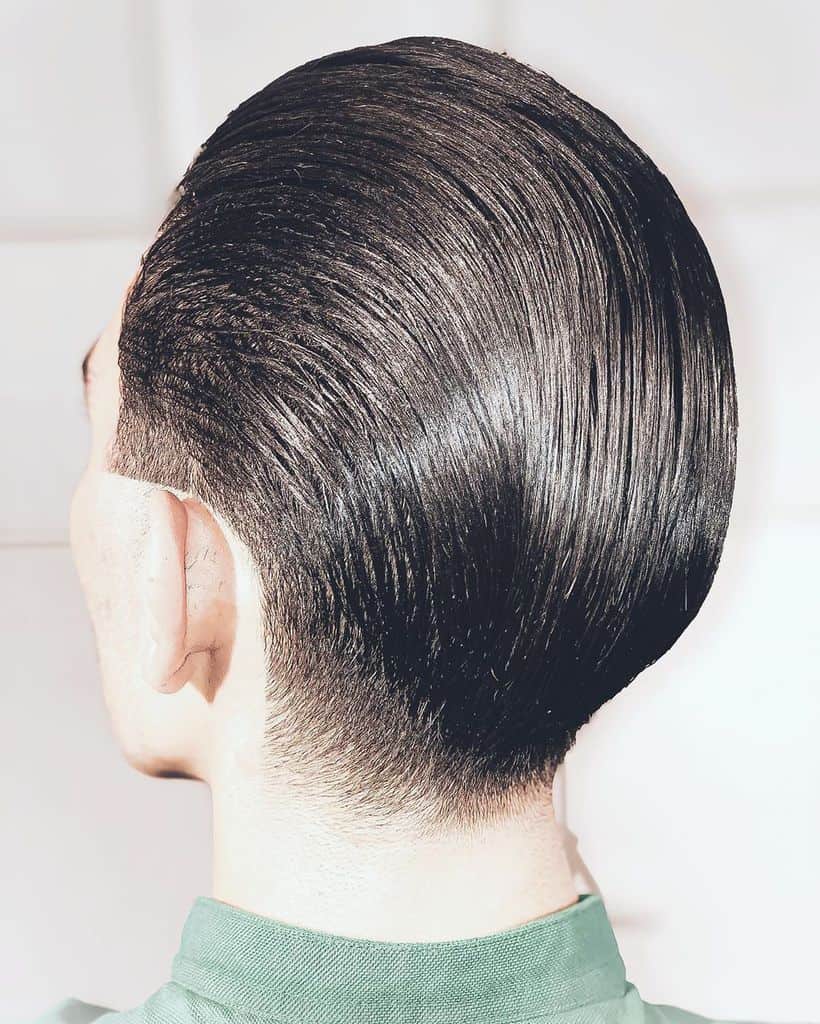 A Slicked Back Pompadour Hairstyle Shown From The Back