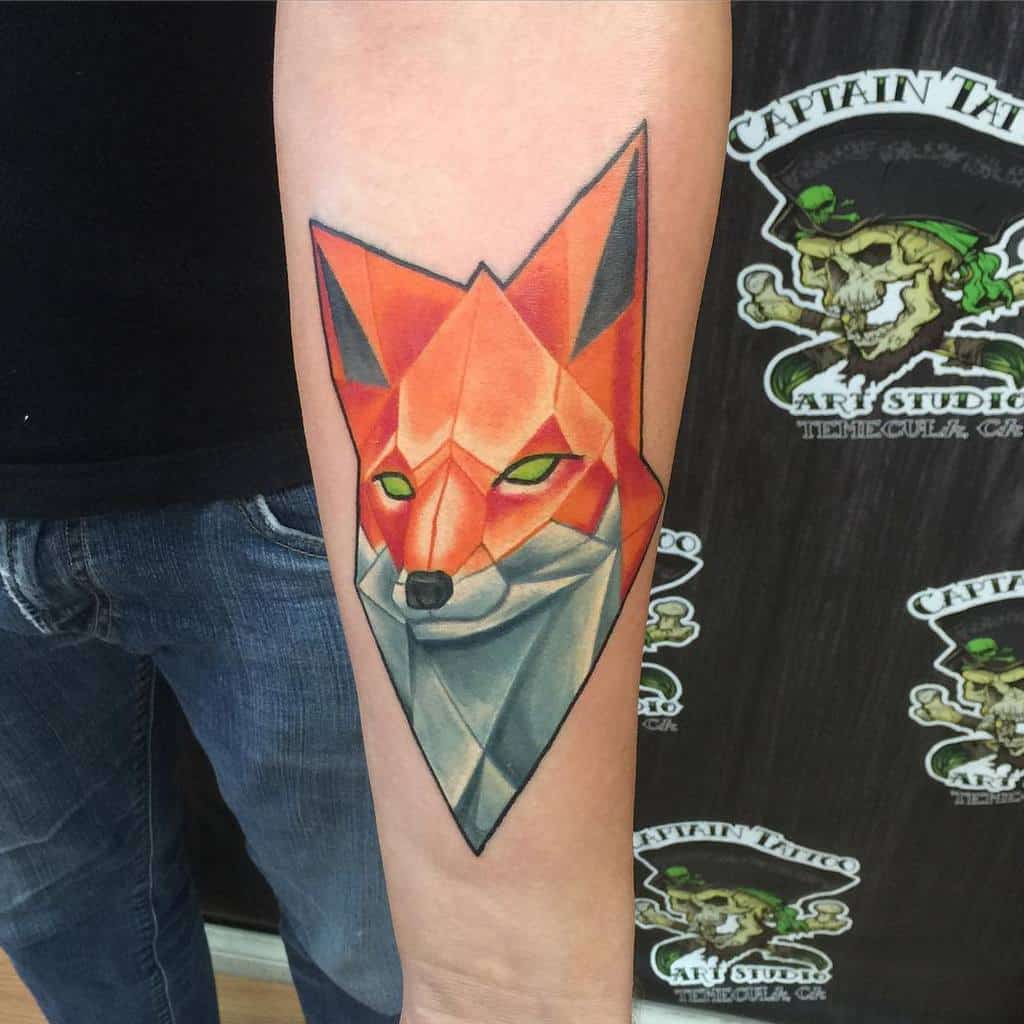 Geometric fox tattoo on a person's forearm