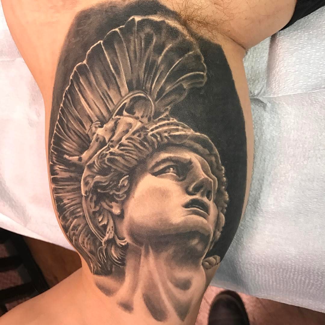 Tattoo of Achilles bust with a helmet on an upper arm