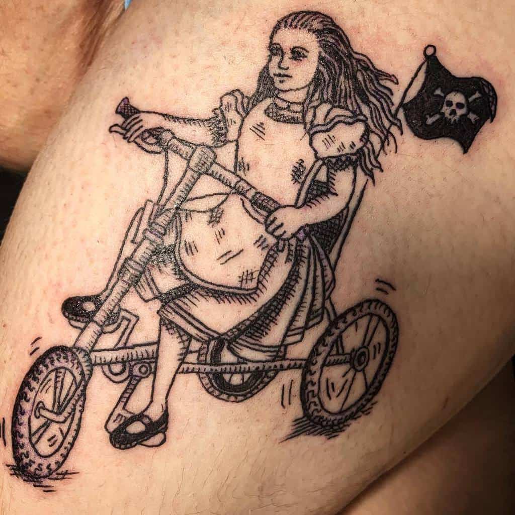 Black and white tattoo of Alice from Alice in Wonderland, riding a tricycle with a pirate flag attached