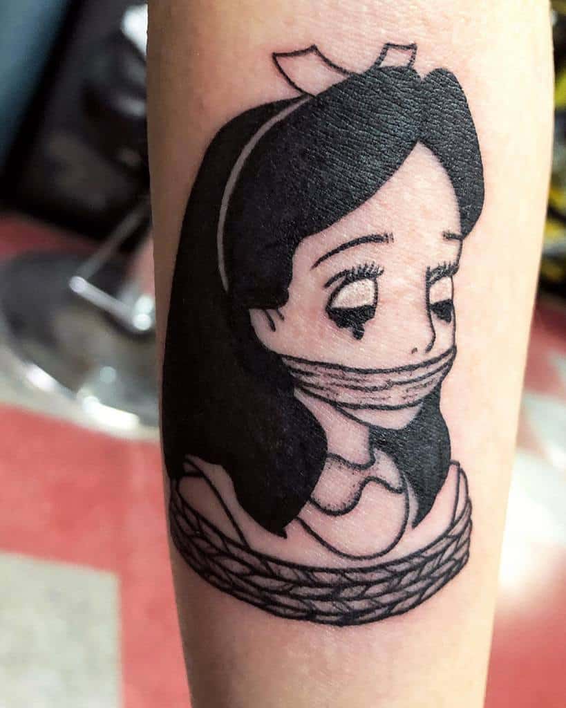 Black and white tattoo of Alice from Alice in Wonderland, with her mouth covered in rope, giving her a distressed expression