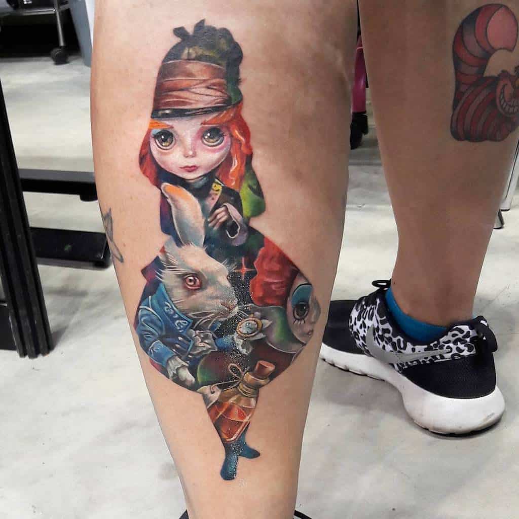 Vibrant tattoo of Alice silhouette from Alice in Wonderland, with the White Rabbit, Mad Hatter, Red Queen and potion bottles