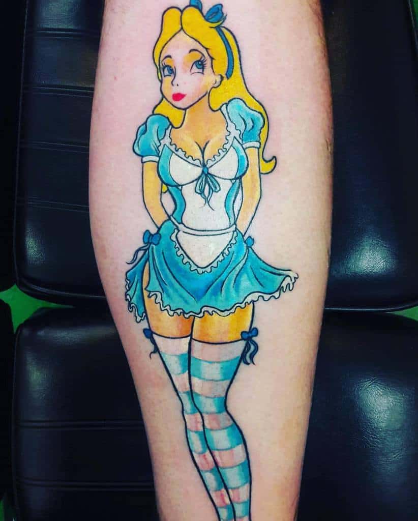 Colorful tattoo of Alice from Alice in Wonderland, wearing her iconic blue dress and striped stockings