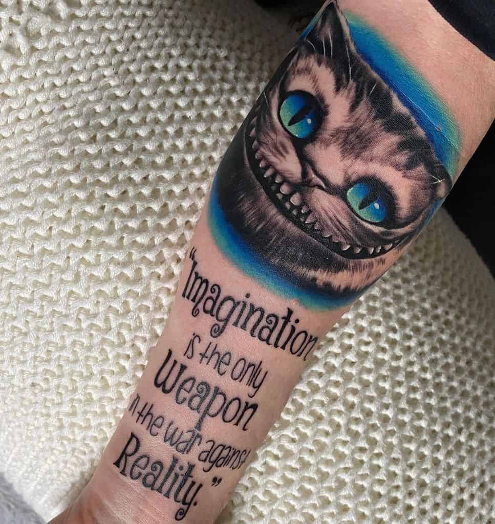 A Cheshire Cat tattoo with glowing eyes, paired with the quote "Imagination is the only weapon in the war against reality"
