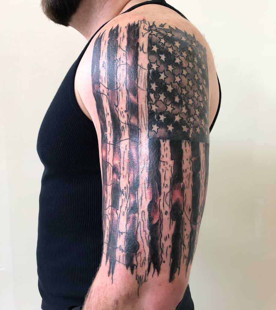Man with American flag tattoo on his upper arm