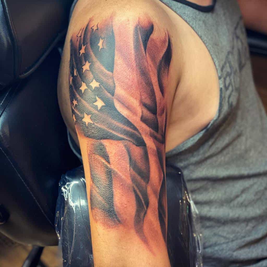 Tattoo of an American flag on a man's upper arm