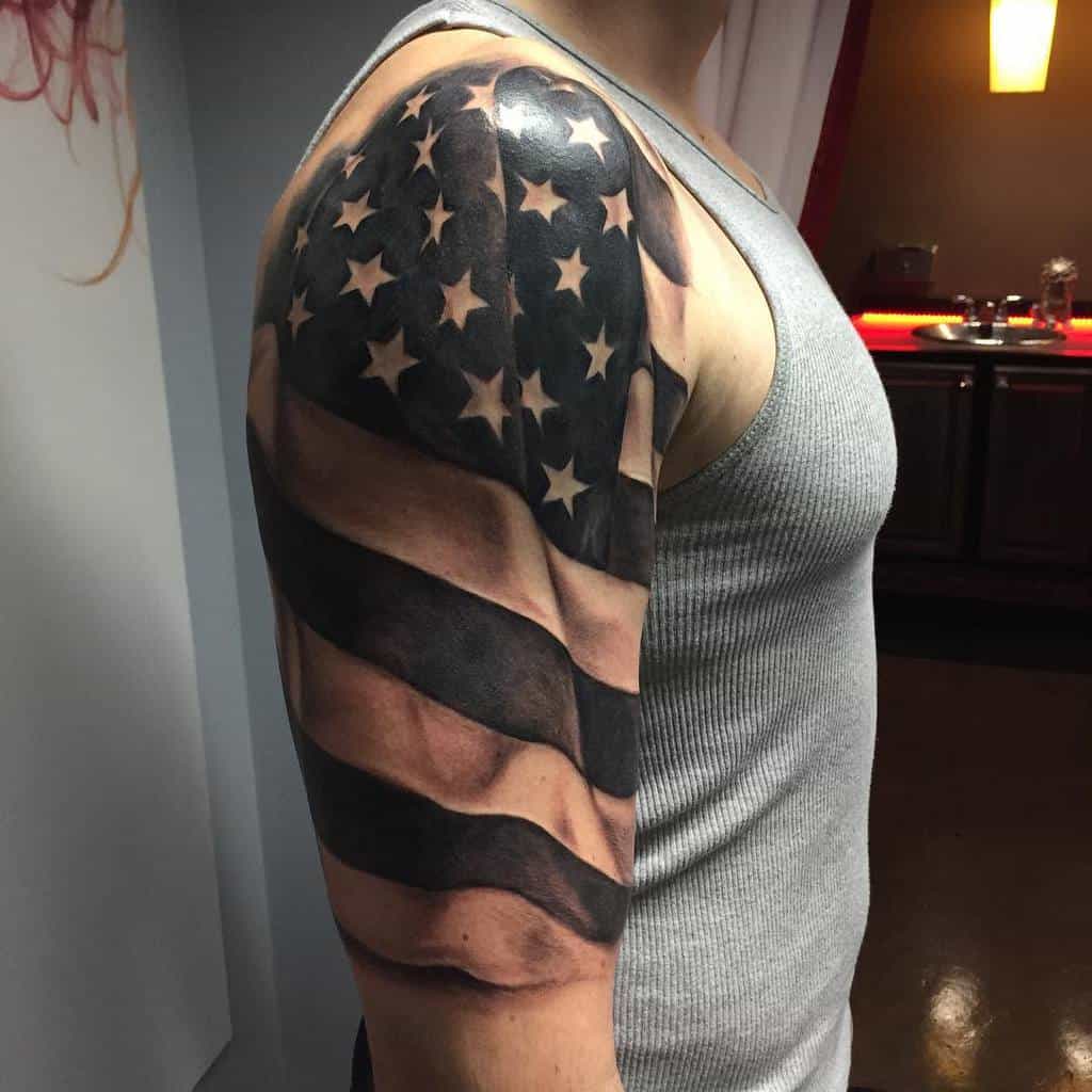 Man with an American flag tattoo on his upper arm
