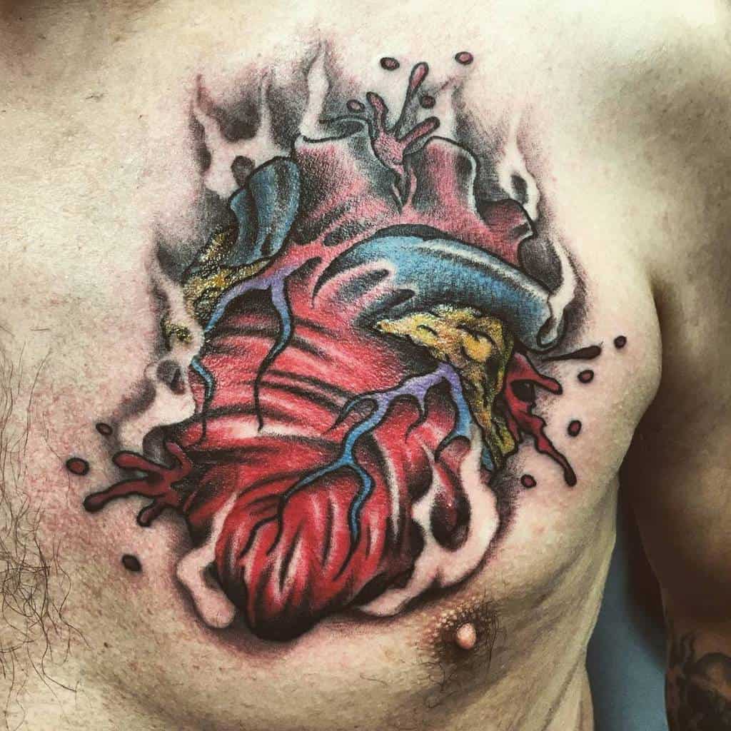 Tattoo of a bleeding heart with vibrant colors and abstract detailing on a person's chest