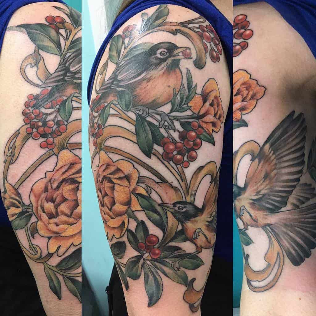 Art Nouveau-style tattoo featuring birds, golden peonies, red berries, leaves and flowing ornamental lines