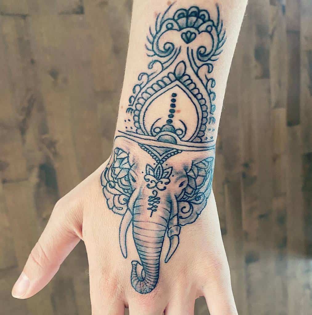 Elegant elephant tattoo featuring intricate mandala and henna-inspired ornamental patterns.