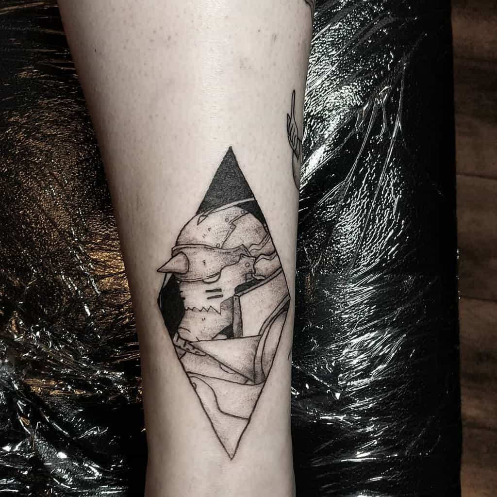 Black ink tattoo of Alphonse Elric from Fullmetal Alchemist, framed within a diamond shape with fine line details and shading