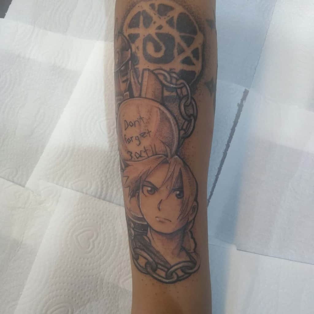 Black and grey Fullmetal Alchemist tattoo featuring Edward Elric, chains, the Flamel symbol, and "Don't forget 3 Oct. 11" inscription
