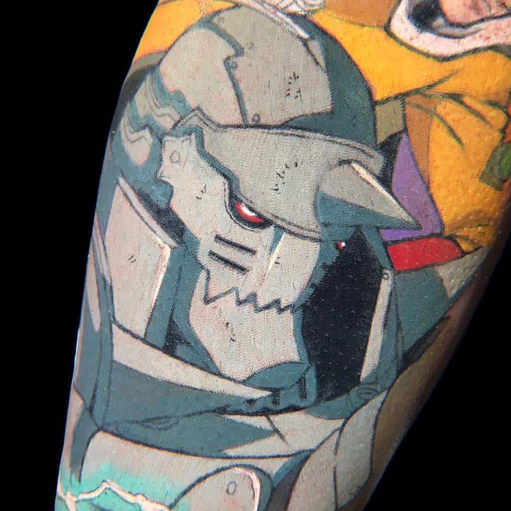 Colorful Fullmetal Alchemist tattoo of Alphonse Elric, featuring his armored form with a red glowing eye and anime-style shading