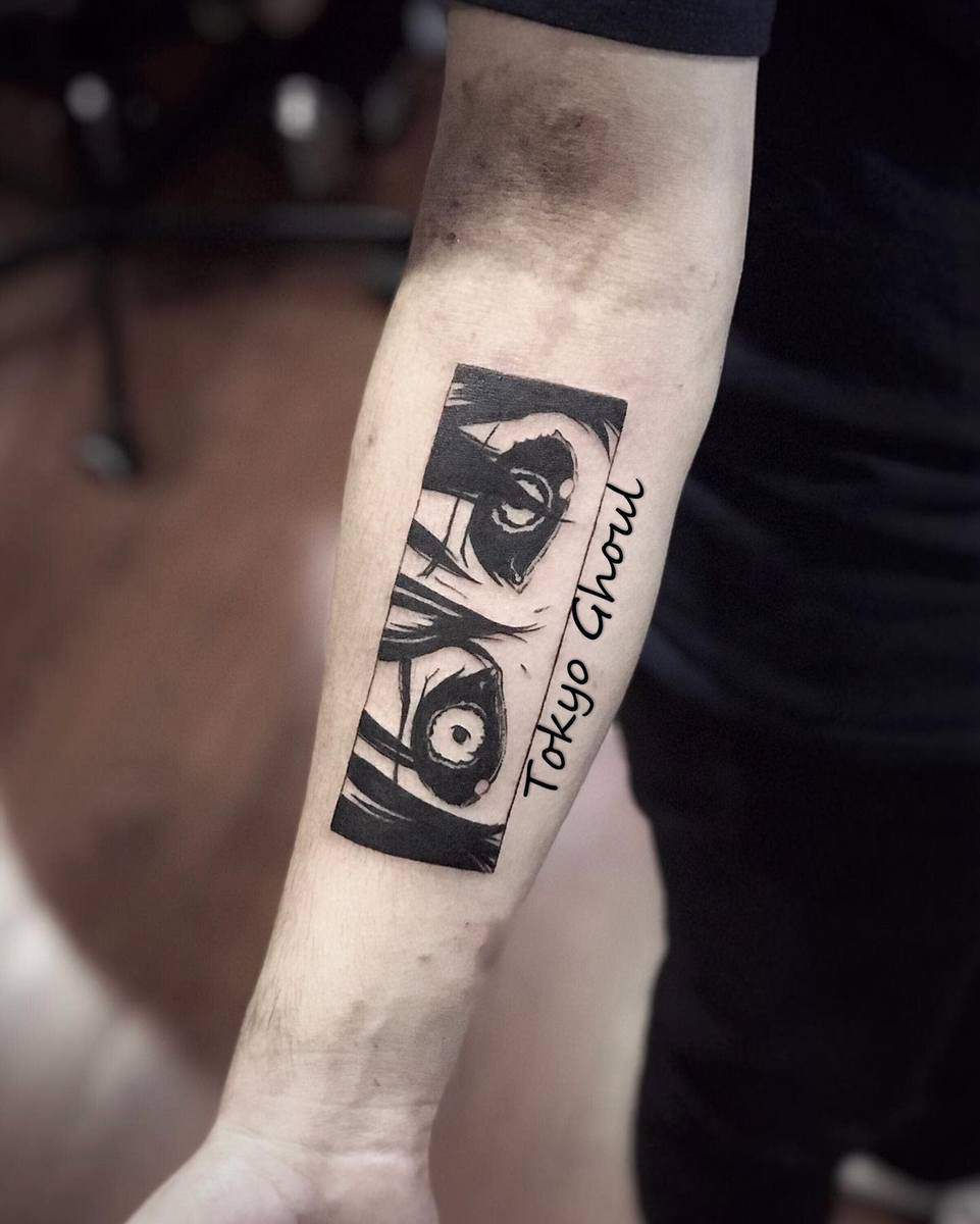 Forearm tattoo of Kaneki Ken's eye from Tokyo Ghoul, with 'Tokyo Ghoul' text alongside it