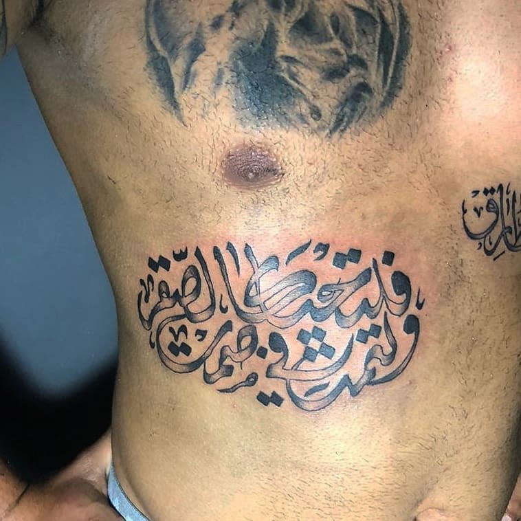 Torso with Arabic calligraphy tattoo