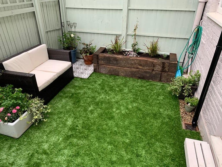 small backyard artificial grass wood planter wicker lounge 