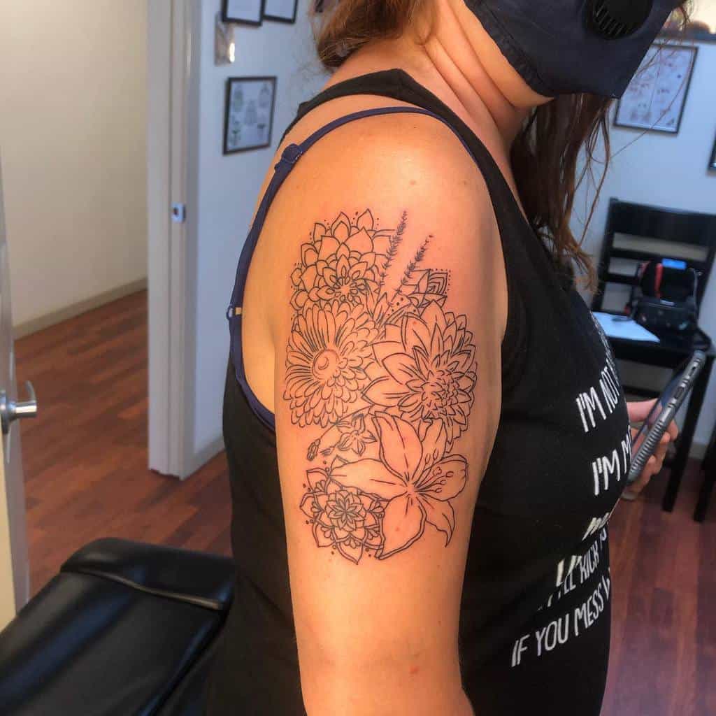 Vibrant floral tattoo with asters