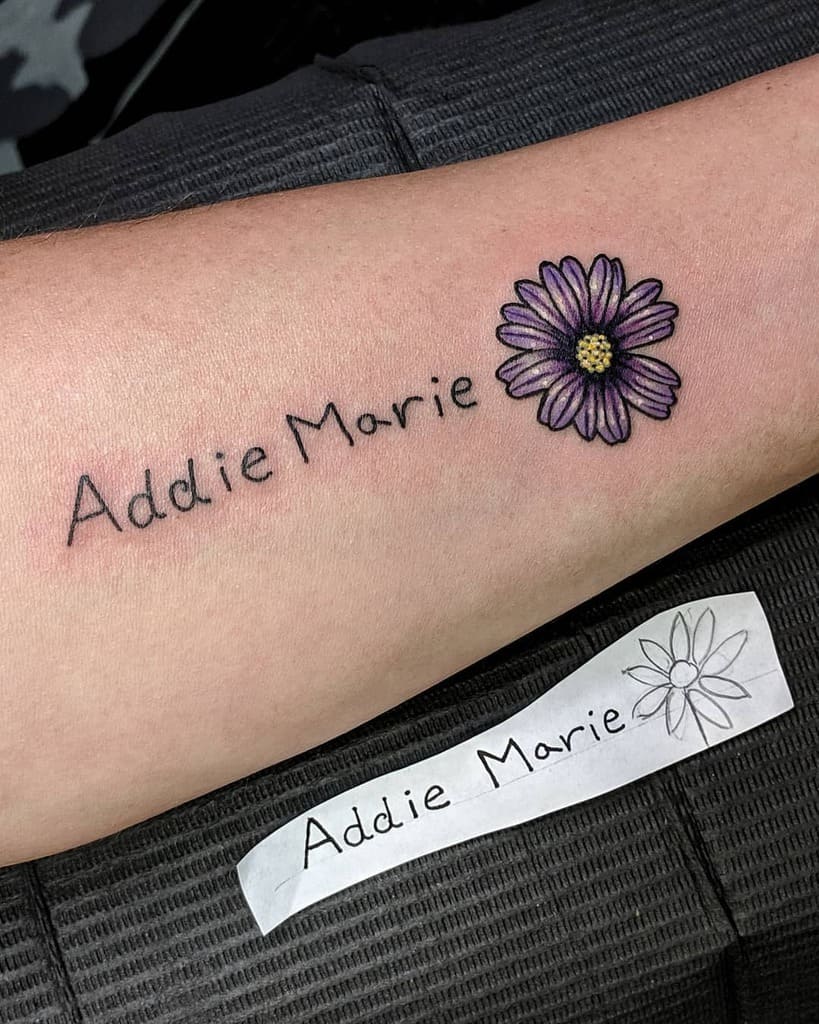 Tattoo of "Addie Marie" with a purple aster flower