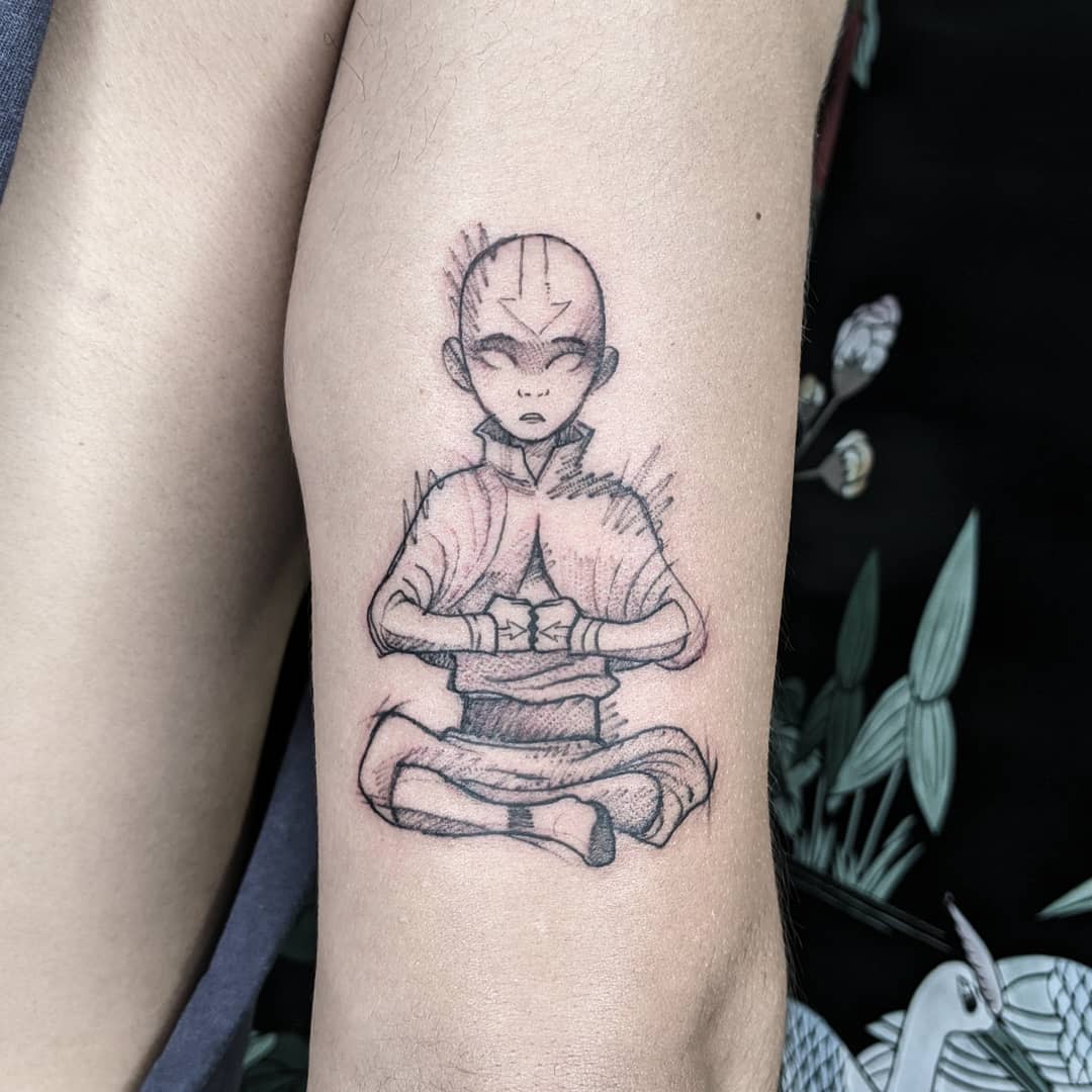 Tattoo of Aang from Avatar: The Last Airbender in a meditative pose, focusing his energy
