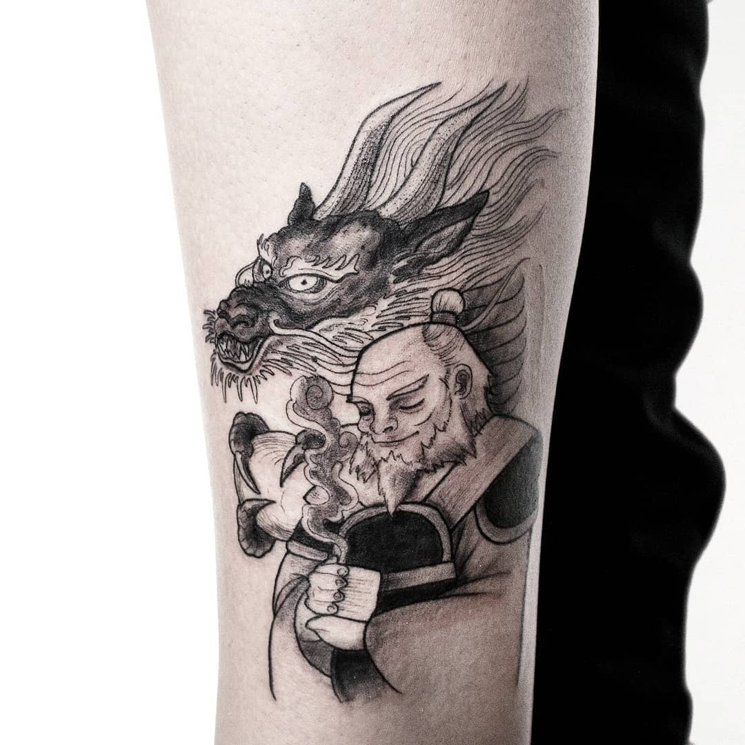 Tattoo of Iroh with a dragon behind him, holding a cup of tea on the forearm